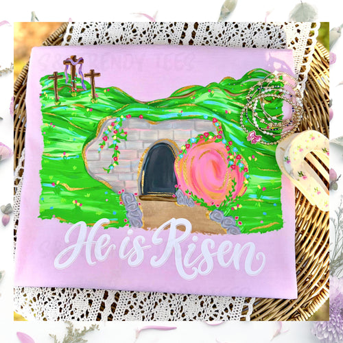 He Is Risen Easter shirt with hand-painted empty tomb and cross design on pink sweatshirt